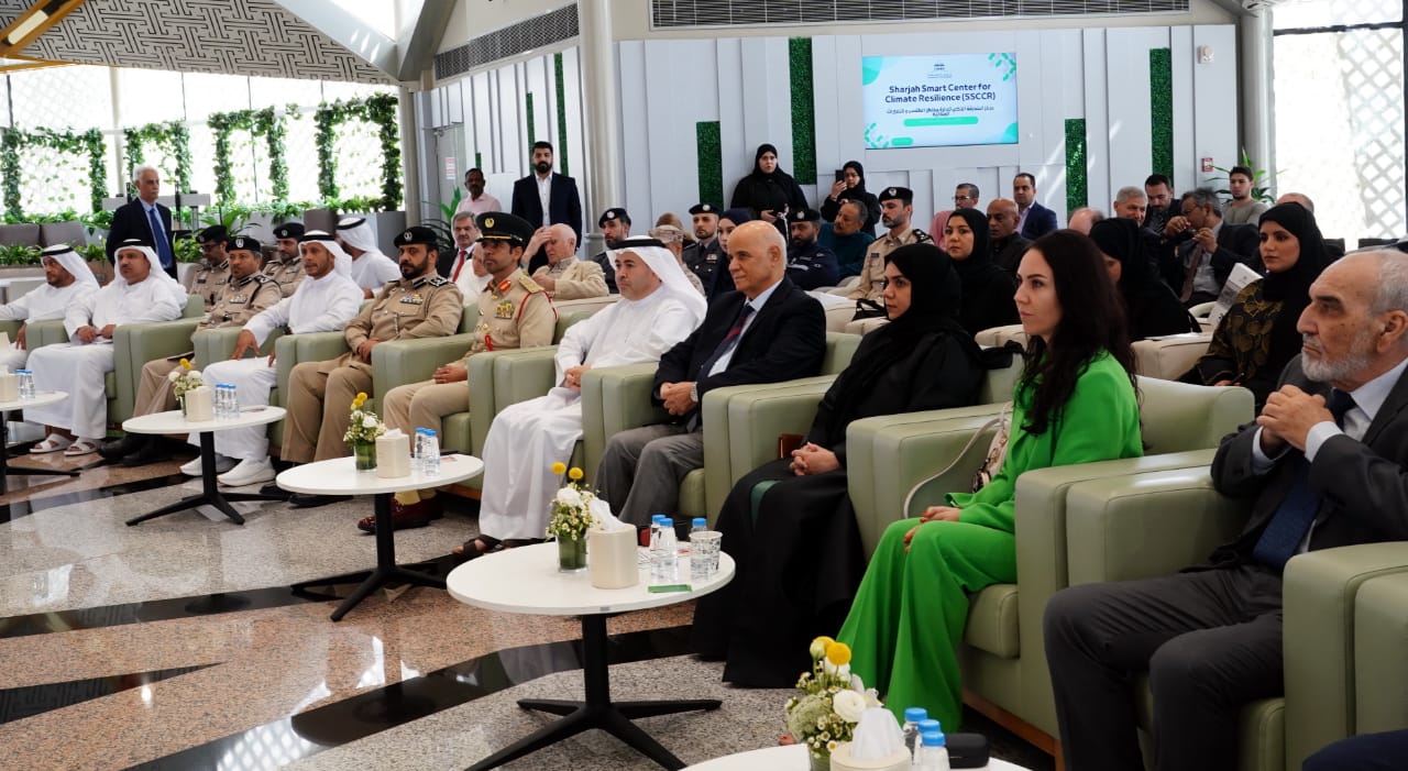 A diverse group of government officials, academic leaders, and climate experts seated at the University of Sharjah during the SSCCR workshop